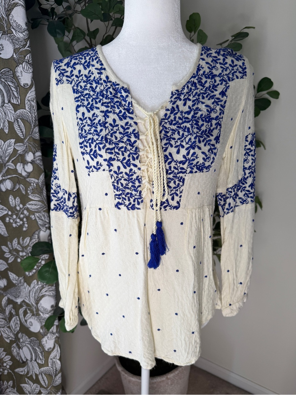 Anthropologie Cream Top with Blue Floral Embroidery and Tassel Tie